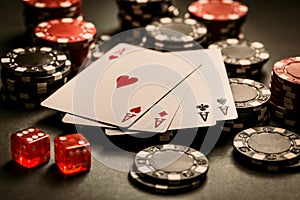 Poker cards and chips on black background, gambling casino table