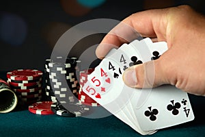 Poker cards with a full house or full boat combination in the player hand. Winning combination in a game in a poker club. The