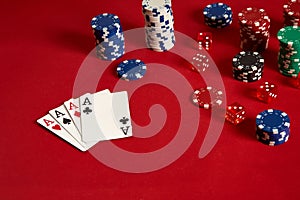 Poker cards and gambling chips on red background