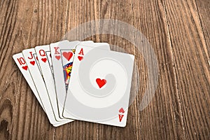 Poker cards over an old wooden table.