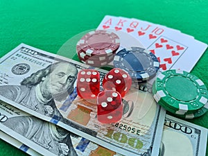 Poker cards royal flush, cash money dollar bills. Gambling, casino chips, dices