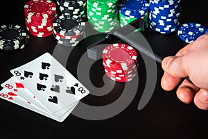 Poker cards with three of a kind or set combination. Rake for chips in hand