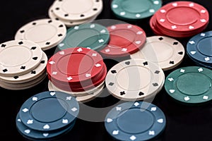 poker chips on a black