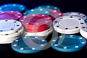 Poker chips on a black