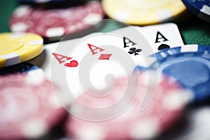 Poker, chips and cards on green table