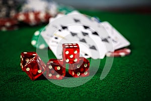 Poker Chips in casino gamble green table.