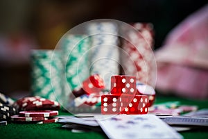 Poker Chips in casino gamble green table.