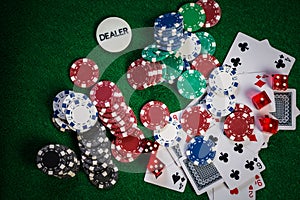 Poker Chips in casino gamble green table.