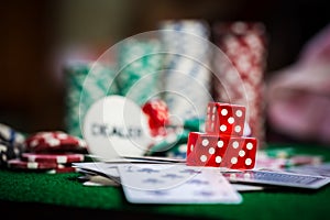 Poker Chips in casino gamble green table.