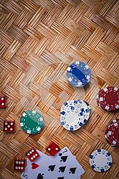 Poker Chips in casino gamble green table.