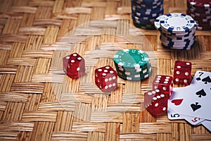 Poker Chips in casino gamble green table.