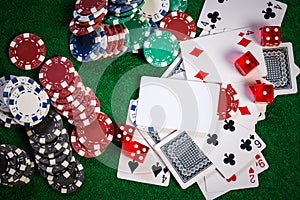 Poker Chips in casino gamble green table.
