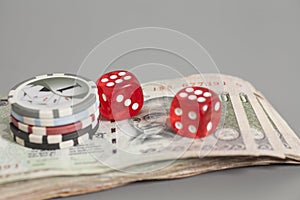 Poker chips end red dices on Indian Currency Rupee bank notes