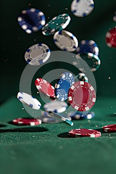 poker chips fall on the poker table