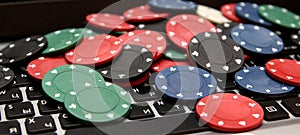 Poker chips on laptop