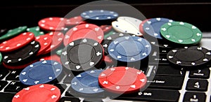 Poker chips on laptop