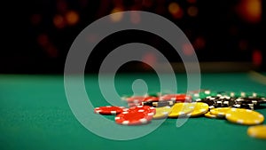 Poker chips lying on green table, poker and blackjack casino games, betting photo