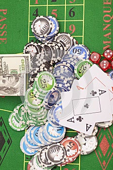 Poker chips, money,playing cards and dice