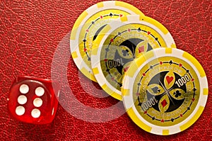 Poker chips and number 6 dice