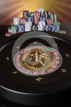 Poker Chips, Roulette wheel in motion, casino background