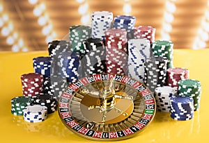 Poker Chips, Roulette wheel in motion, casino background