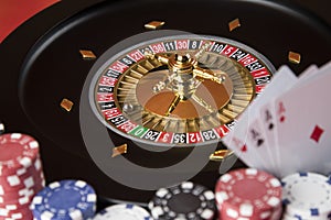 Poker Chips, Roulette wheel in motion, casino background