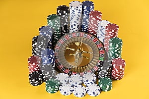 Poker Chips, Roulette wheel in motion, casino background