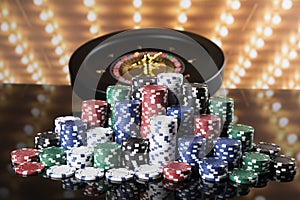 Poker Chips, Roulette wheel in motion, casino background