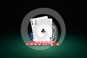 Poker chips on table with aces cards