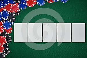 Poker chips on table with blank cards