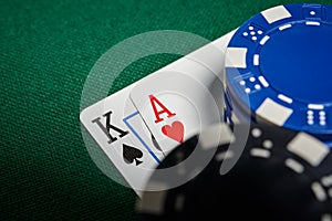 Poker chips on table with cards