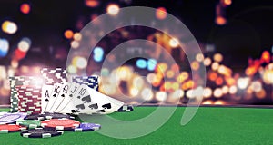 Poker flush royal background with casino chips on green table