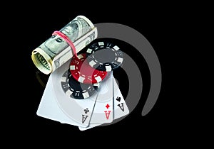 Poker game with a three of a kind or set combination and dollars. Chips and cards on the black table in poker club. Free