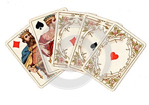 A poker hand of antique playing cards showing a full house.