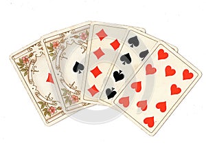 A poker hand of antique playing cards showing a full house.