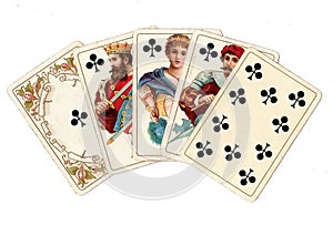 A poker hand of antique playing cards showing a royal flush of clubs.