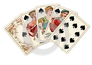 A poker hand of antique playing cards showing a royal flush of spades.