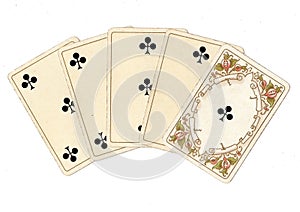 A poker hand of antique playing cards showing a straight flush of clubs.