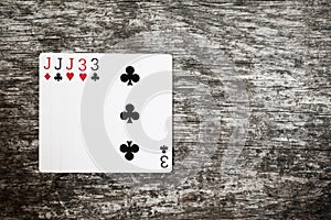 Poker hand: full house. playing cards game abstract in wooden table