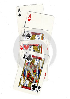 A poker hand of playing cards showing a full house.