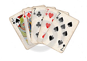A poker hand of vintage playing cards.