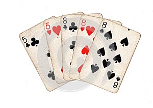 A poker hand of vintage playing cards.