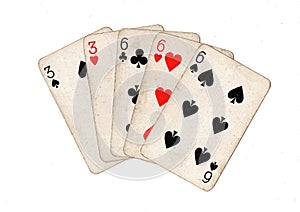 A poker hand of vintage playing cards.