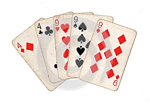 A poker hand of vintage playing cards.