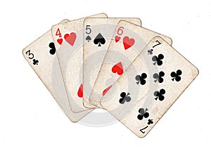 A poker hand of vintage playing cards.