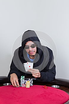 Poker player shows winning pocket aces