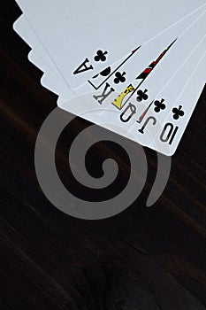 Poker. Playing cards on black background. Royal flush