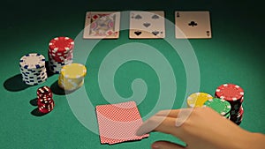 Poker professional checking cards, betting chips to raise bank, game strategy