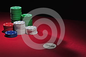 Poker table chips and dealer photo