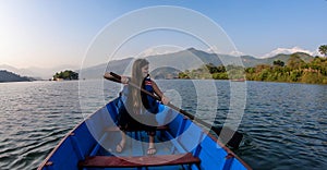 Pokhara - A woman enjoying a boat tour on Phewa Lake